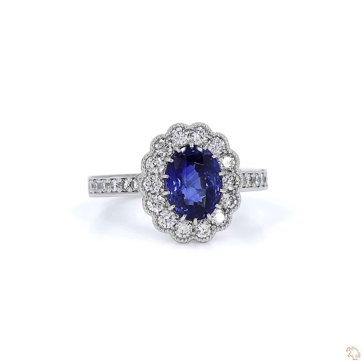 Blue Sapphire and Diamond Halo Platinum Ring