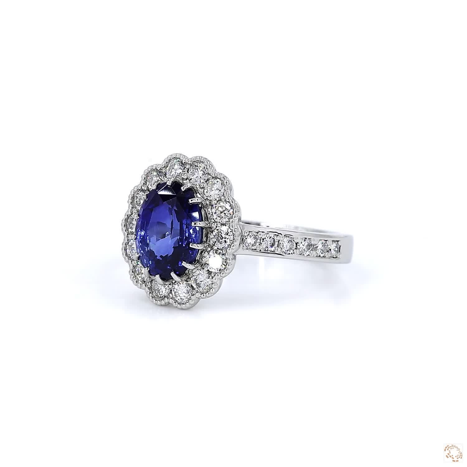 Blue Sapphire and Diamond Halo Platinum Ring