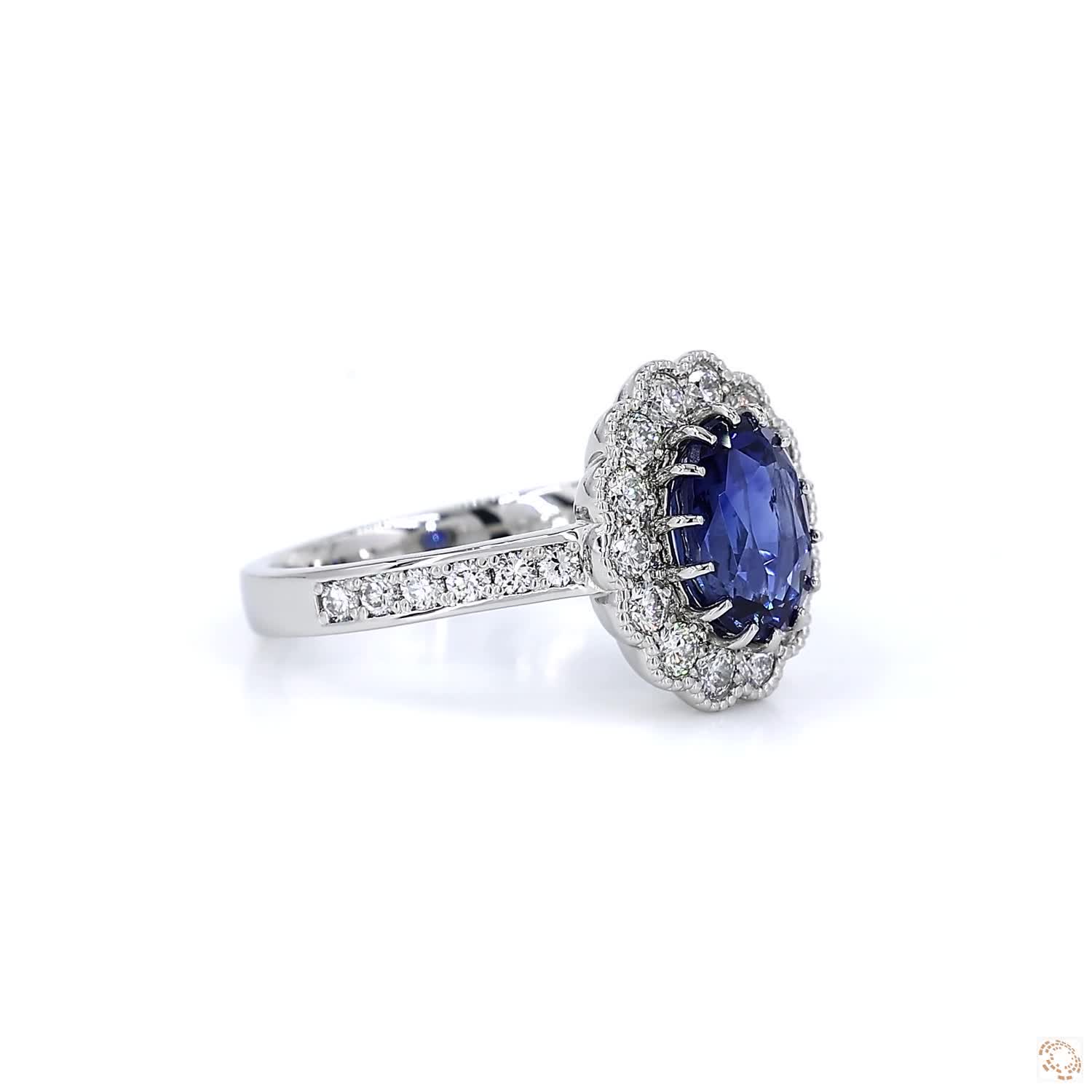 Blue Sapphire and Diamond Halo Platinum Ring