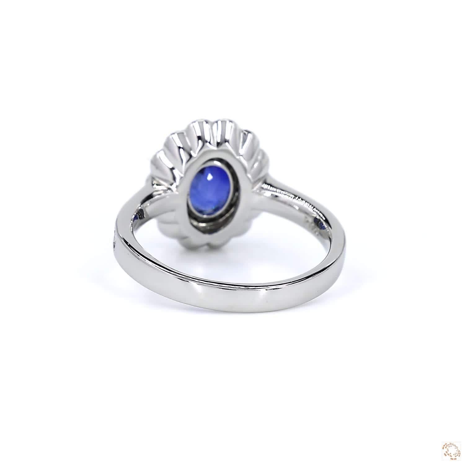 Blue Sapphire and Diamond Halo Platinum Ring